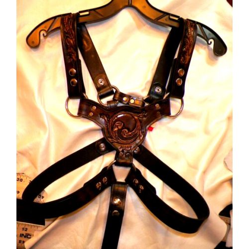 A Brown and Black leather Harness With Design