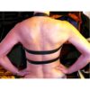 The back of a woman wearing a leather bra