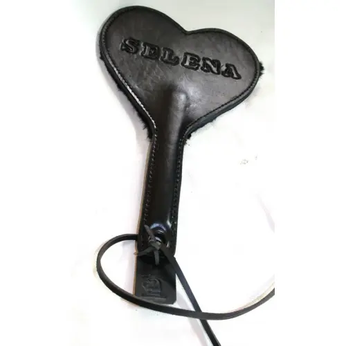 A Black Color Heart Shaped Leather Paddle