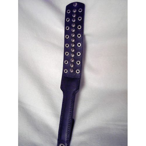 A Black Color Leather Flapper Paddle With Metal Rings