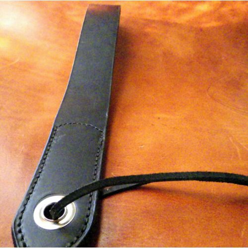 A Black Color Leather Band With a Metal Hole Band