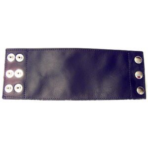 A Plain Black Color Leather Band Laid on a Surface