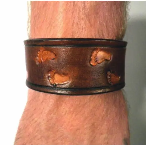 A Footprint Design Leather Band on a Hand