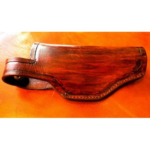 A Polished Leather Pistol Case With Stitched Edges