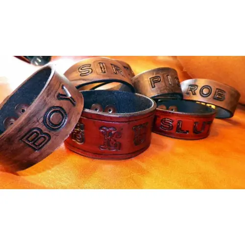 A Bunch of Leather Band With Wordings on Top Side