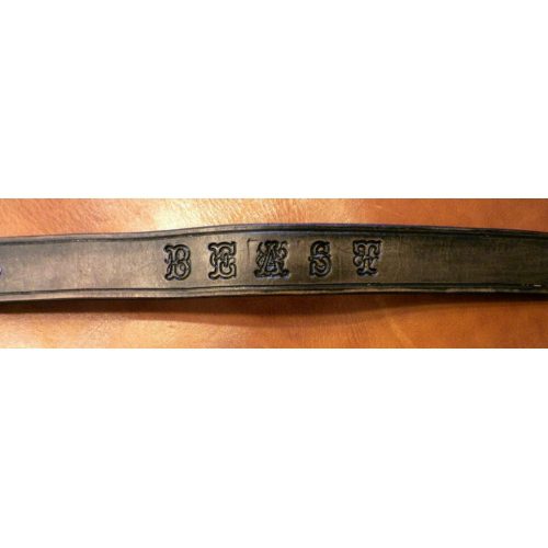 A Leather Band With Lettering Design Laid Down