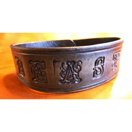 A Dark Brown Color Leather Band With Letter Design